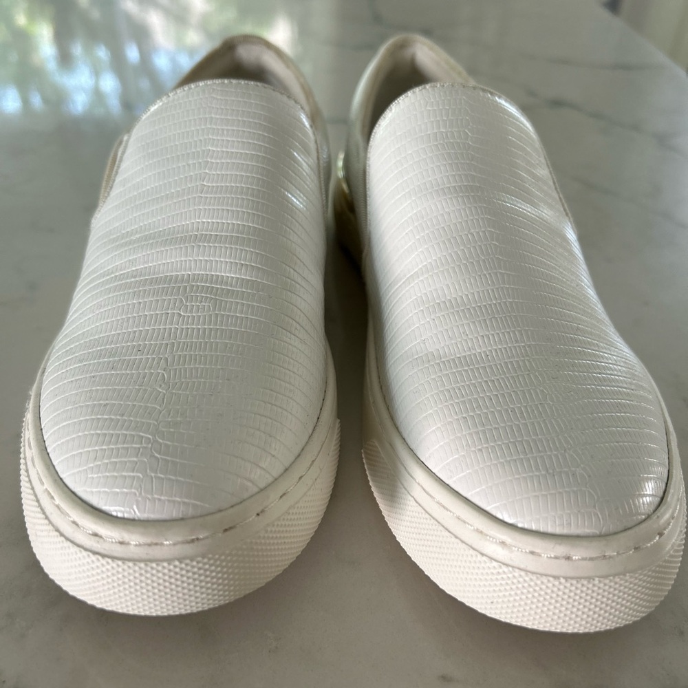 Aldo brand White slip ons with gold trim
